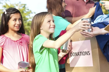 girls-helping-kids-donations-charity.jpg